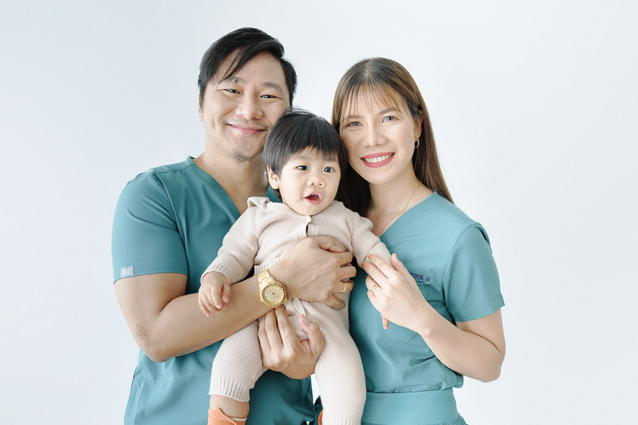 Pediatricians in Cavite: Family pediatricians holding their child