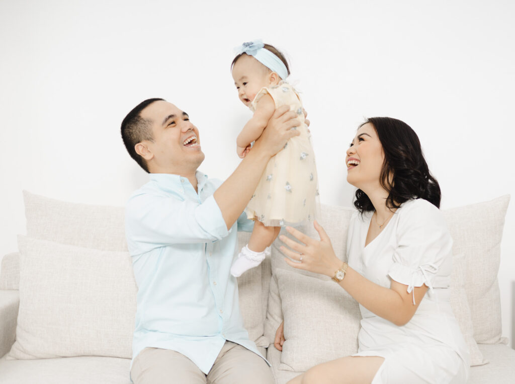 family of three, all smiling